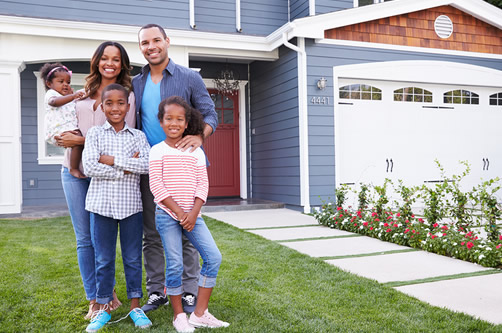 Family in front of house