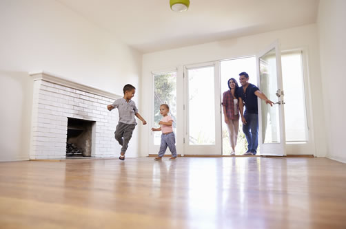 Family walking into house